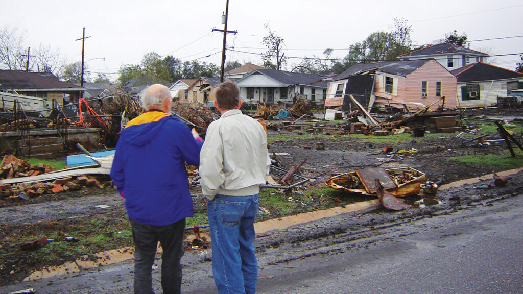 Mennonite Disaster Service volunteers survey the damage of Hurricane Katrina in December 2005. — MDS