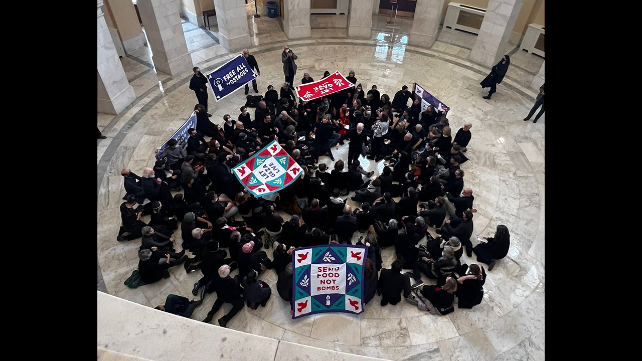 About 135 activists sing hymns and chant for a cease-fire in Gaza Jan. 16 in the rotunda of the House of Representatives’ Cannon House Office Building in Washington, D.C. Mennonite Action organized the event. — Mennonite Action