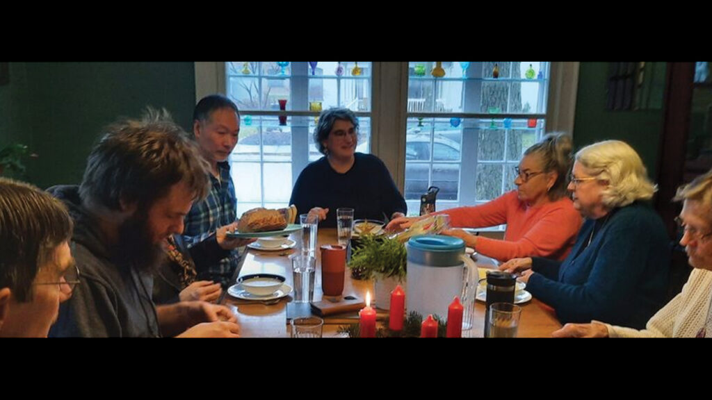 Members of Open Table Mennonite Fellowship in Goshen, Ind., gather for a simple meal during Advent. — Open Table Mennonite Fellowship