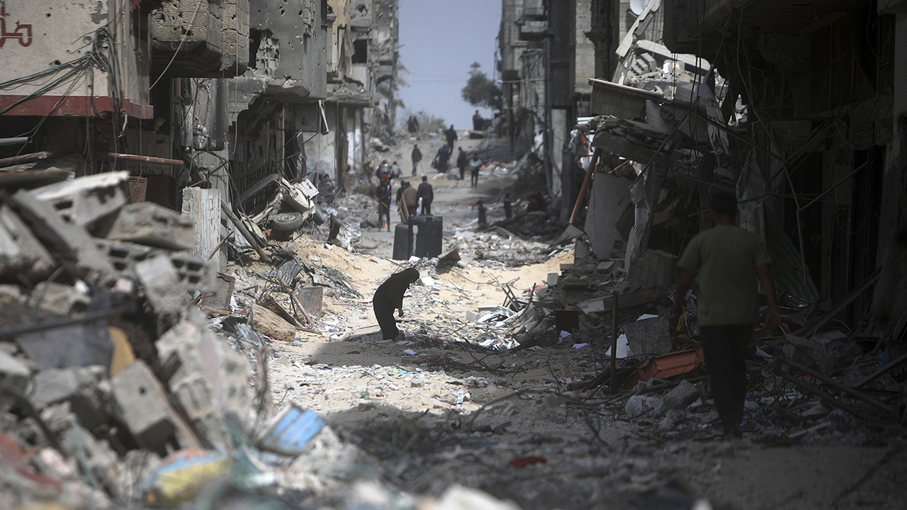 Palestinians visit their destroyed homes March 6 after Israeli forces left Khan Younis, Gaza Strip. — Mohammed Dahman/AP