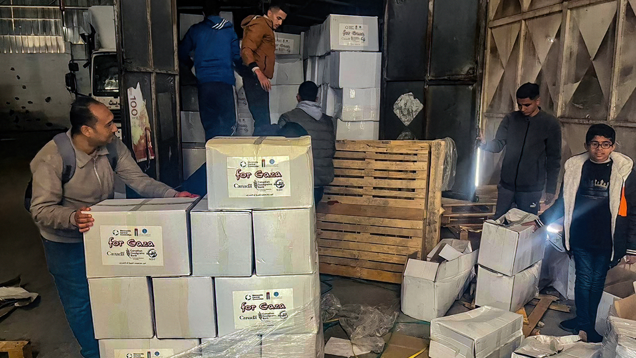 Al-Najd Developmental Forum staff unload emergency food from Mennonite Central Committee in Gaza for distribution to families in Deir al Balah and surrounding areas. — Al-Najd Developmental Forum