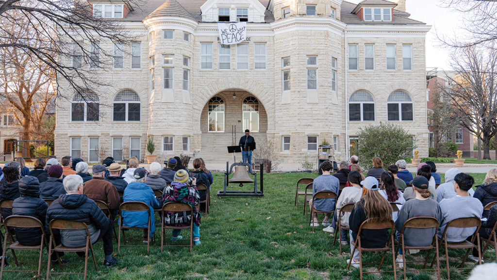 Jerrell Williams, pastor of Shalom Mennonite Church and a Bethel College graduate, speaks April 3 at a vigil preceding three days of ringing a bell on the Bethel campus to mourn lives lost in Gaza and Israel. — Andrew Graber