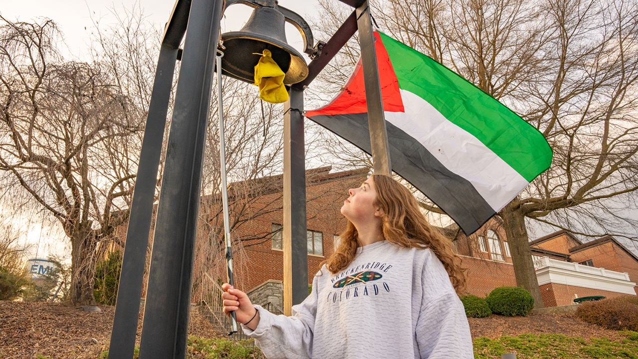 Eastern Mennonite University student Kate Stutzman rings the campus bell in remembrance of lives lost in Gaza. Students rang the bell every four seconds March 18-20, each toll representing each of the more than 30,000 people killed in Palestine and Israel since the start of the war. — Macson McGuigan/EMU