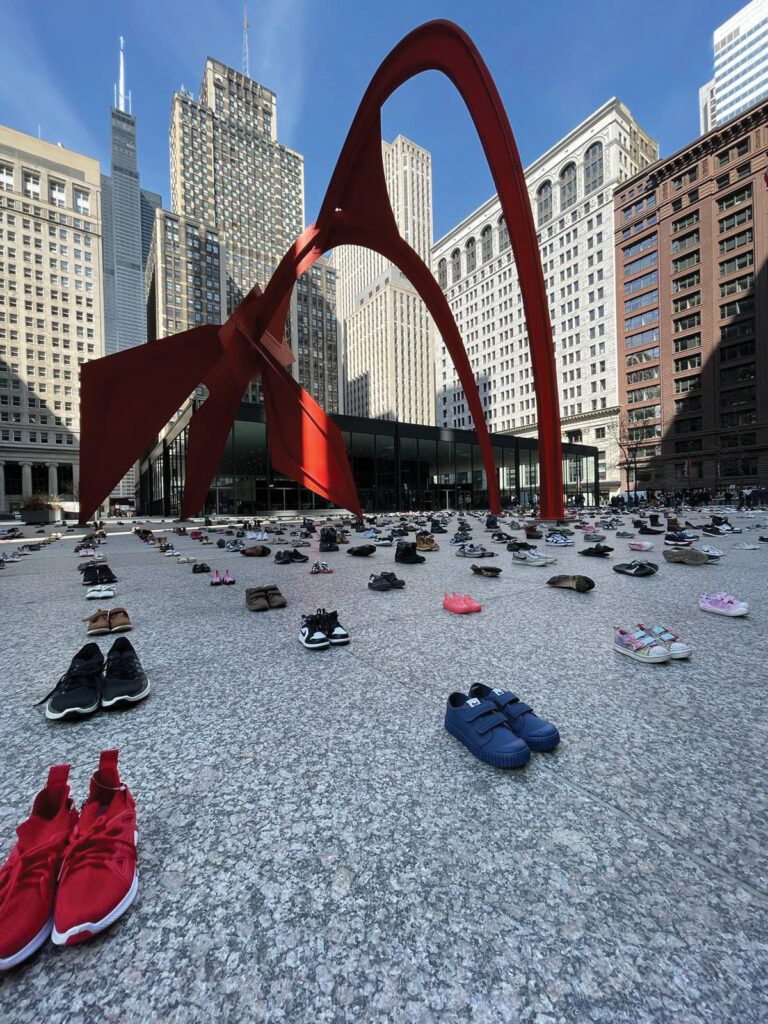 1,400 pairs of shoes, each representing 25 lives lost in Gaza, sit in Chicago’s Federal Plaza on Good Friday, March 29, in an interfaith demonstration calling for a cease-fire in Gaza and the release of all hostages in the war with Israel. — Dale Fast