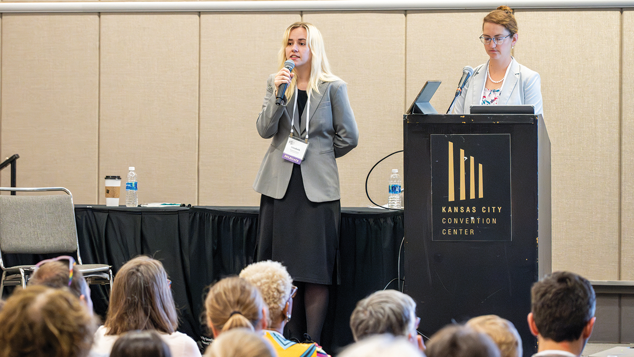 Elizabeth Johnson, left, a doctoral candidate at Duke University and member of Raleigh Mennonite Church in North Carolina, speaks at the 2023 Mennonite Church USA convention in Kansas City, Mo., on “Toward a Church in Which Women in Ministry Thrive.” Johnson and Amy S. Zimbelman, right, conference minister of Mountain States Mennonite Conference, conducted a nationwide study on the experiences of women pastors. — Ken Krehbiel/MC USA