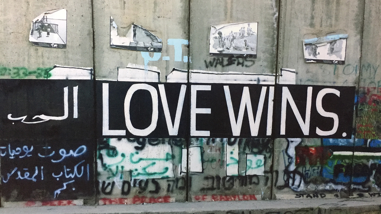 Graffiti on the separation wall between Bethlehem and Jerusalem, photographed on an Eastern Mennonite University trip in 2017. — Lisa Schirch