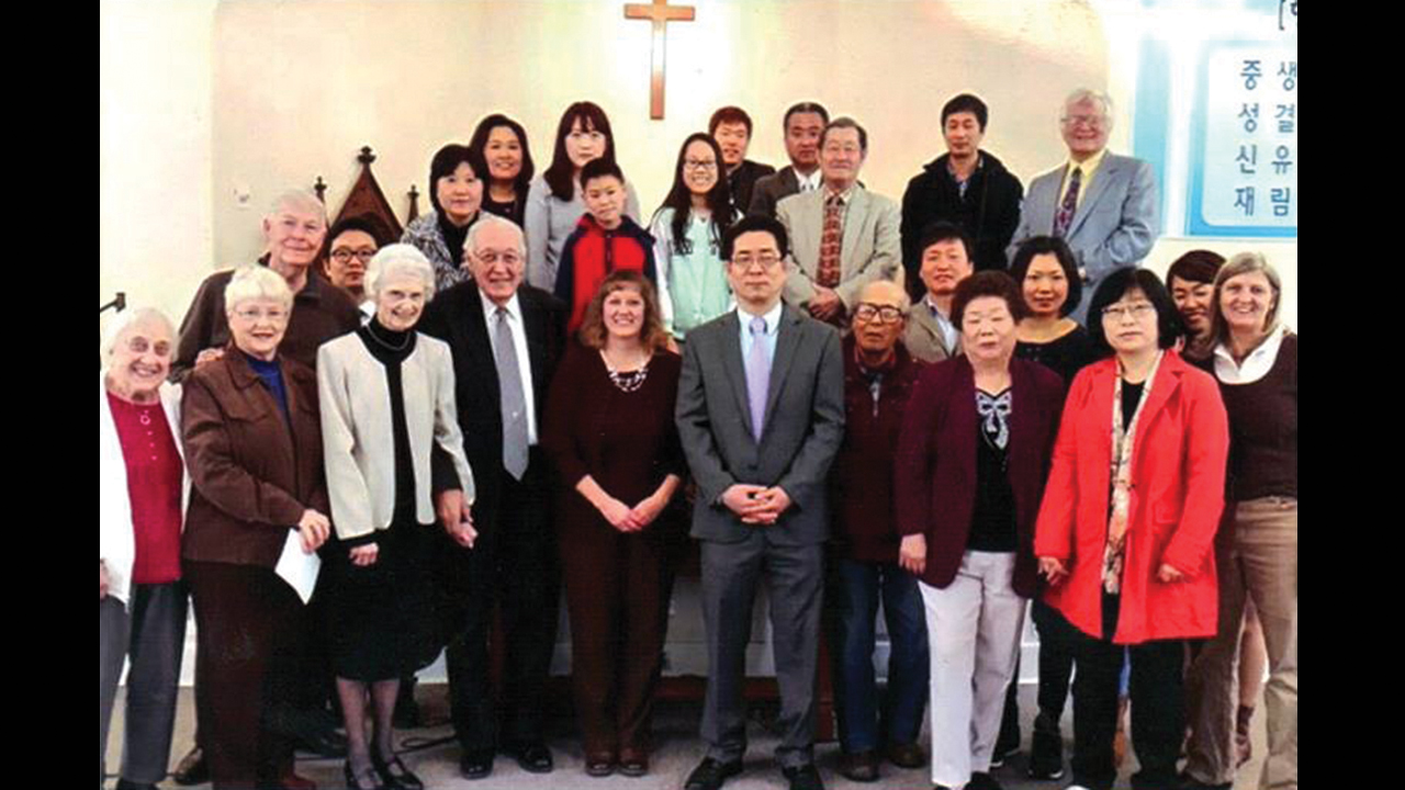 Members of First Mennonite Church of Philadelphia, now also known as Grace Bible Fellowship, pose for a photo with Korean Evangelical Church of Philadelphia in 2015. The Korean congregation shares the church building and the congregations come together for joint services. — First Mennonite Church of Philadelphia