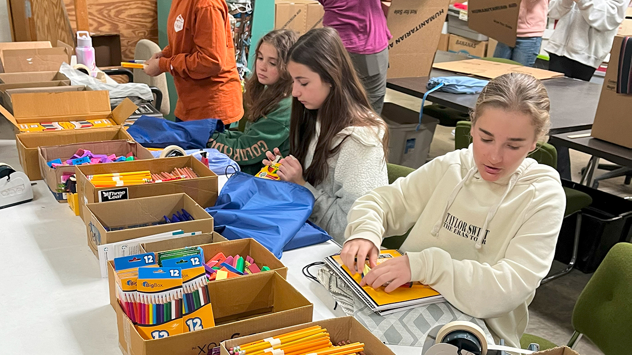 Lancaster Mennonite School students pack Mennonite Central Committee school kits at the MCC East Coast Material Resources Center in Ephrata, Pa., in March. — Lancaster Mennonite School