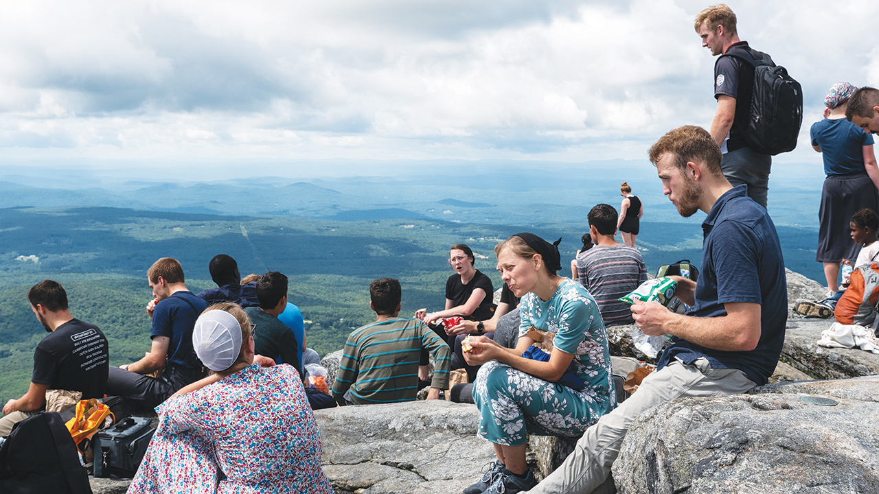 Sattler College students hike and eat lunch in New Hampshire as part of their new student orientation. Students, staff and families take part in the new student retreat and get to know one another before the school year begins. — Sattler College