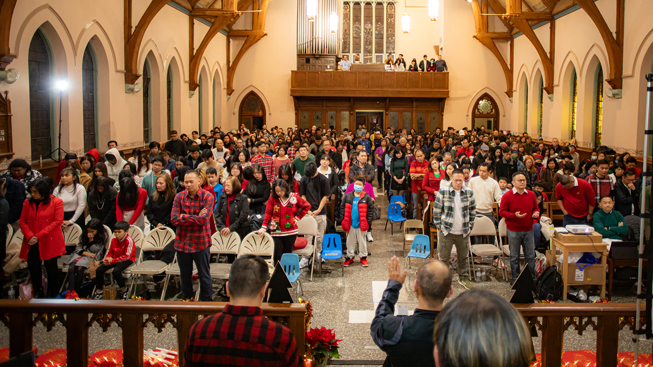 Pastor Aldo Siahaan prays during a Christmas service at Philadelphia Praise Center in December 2023. — Haris Tijo