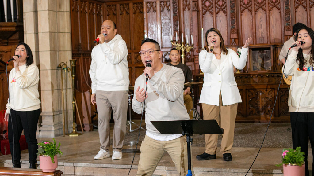 Sandrie Wahyu, front center, leads worship at Philadelphia Praise Center. — Haris Tijo
