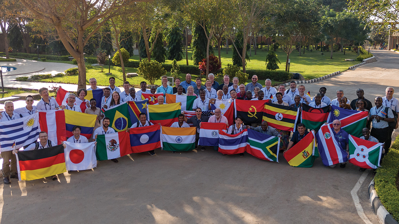 Participants display national flags at the International Community of Mennonite Brethren summit June 4-9 in Malawi. — Christian Leader