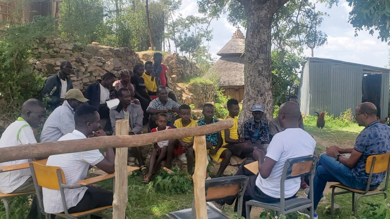 Mekonnen Gemeda facilitates group discussion with elders and children in the community in Southern Ethiopia Regional State. — MKC News