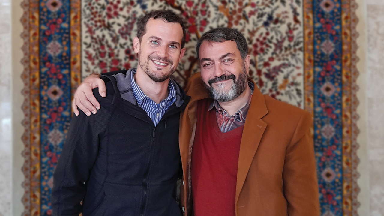 Peter Sensenig, left, who serves with Mennonite Mission Network and Eastern Mennonite Missions, meets with Mohammad-Taghi Eslami of the Islamic Sciences and Culture Academy at an interfaith dialogue in Qom, Iran, in March. — Mohammad Kashani