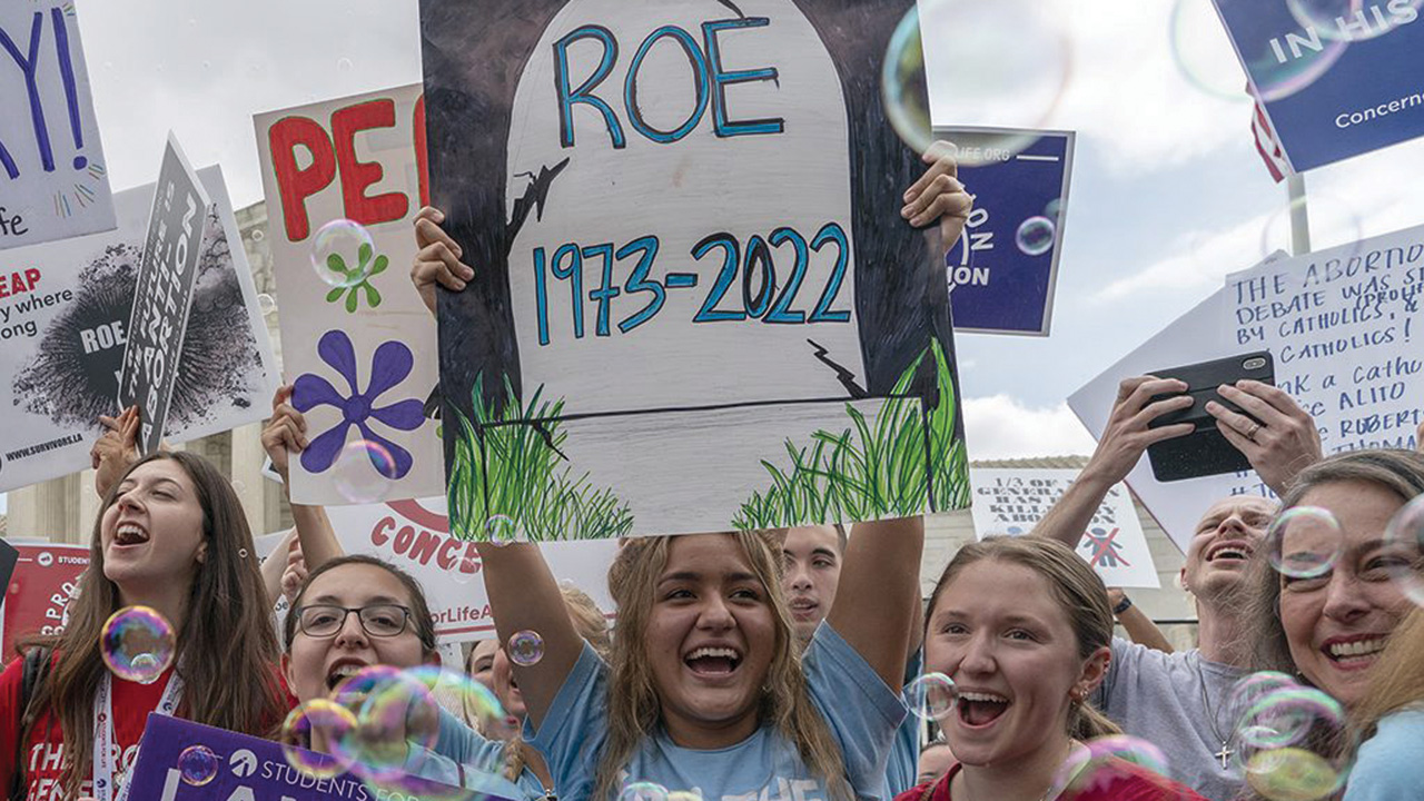 Anti-abortion protesters celebrate after the Supreme Court’s decision to overturn Roe v. Wade, the federally protected right to abortion, June 24, 2022. — Gemunu Amarasinghe/AP