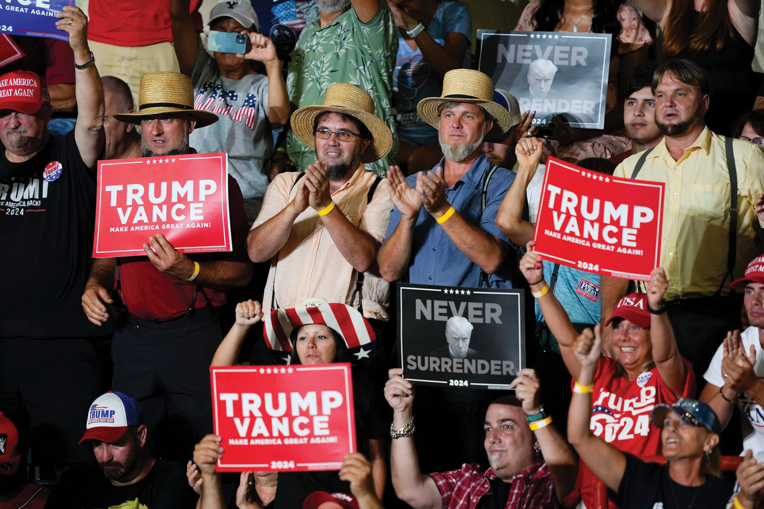 Supporters applaud Republican presidential candidate Donald Trump during a campaign rally in Harrisburg, Pa., on July 31. — Mike Rourke/AP