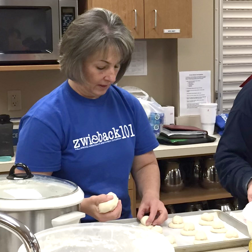 Lynn Wiebe teaches how to shape zwieback dough in “Zwieback 101” at Hillsboro Mennonite Brethren Church in Kansas. — Molly Wiebe Faber