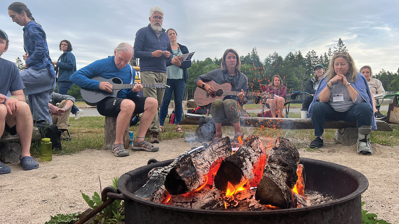 Douglas Day Kaufman, Anabaptist Climate Collaborative executive director, and Nicole Diroff, BTS Center associate director, standing, lead a ritual of lament during the retreat in June at Acadia National Park in Maine. — Courtesy of Douglas Day Kaufman