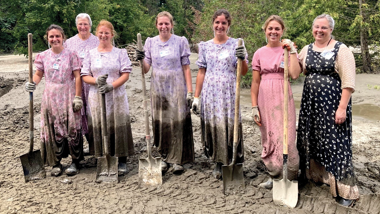 Seven Mennonite Disaster Service volunteers from Riverdale Old Order Mennonite Church near Dayton, Va., carried 2,700 buckets of muck in less than a day July 29 in Barre, Vt. — Brent Trumbo/MDS