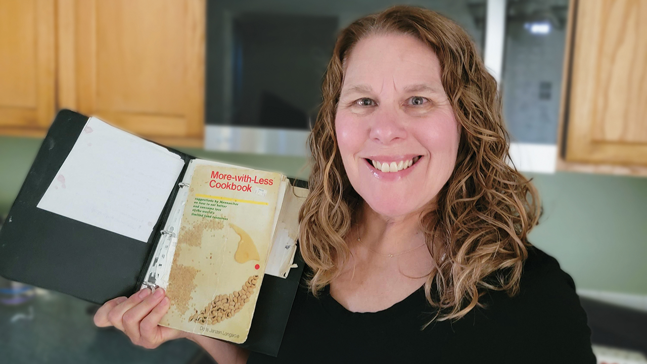 Karla Morton with her More-with-Less cookbook, the second one she’s owned, acquired in 1986. “We got one in 1981, the year we were married, but as we were moving from Philadelphia, somehow the box with cookbooks and knives disappeared. Notice that we paid $7.96 for this one as a ‘donation.’ It came from a little Christian bookstore in Scottsdale or Tempe, Ariz.” A three-ring binder holds it (mostly) together. — Courtesy of Karla Morton