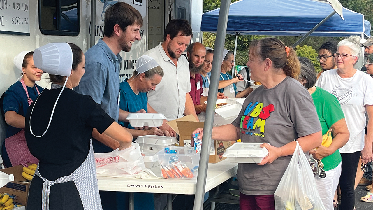 Christian Aid Ministries’ Loaves & Fishes mobile food kitchen serves meals in Lake Lure, N.C., following Hurricane Helene. —Christian Aid Ministries