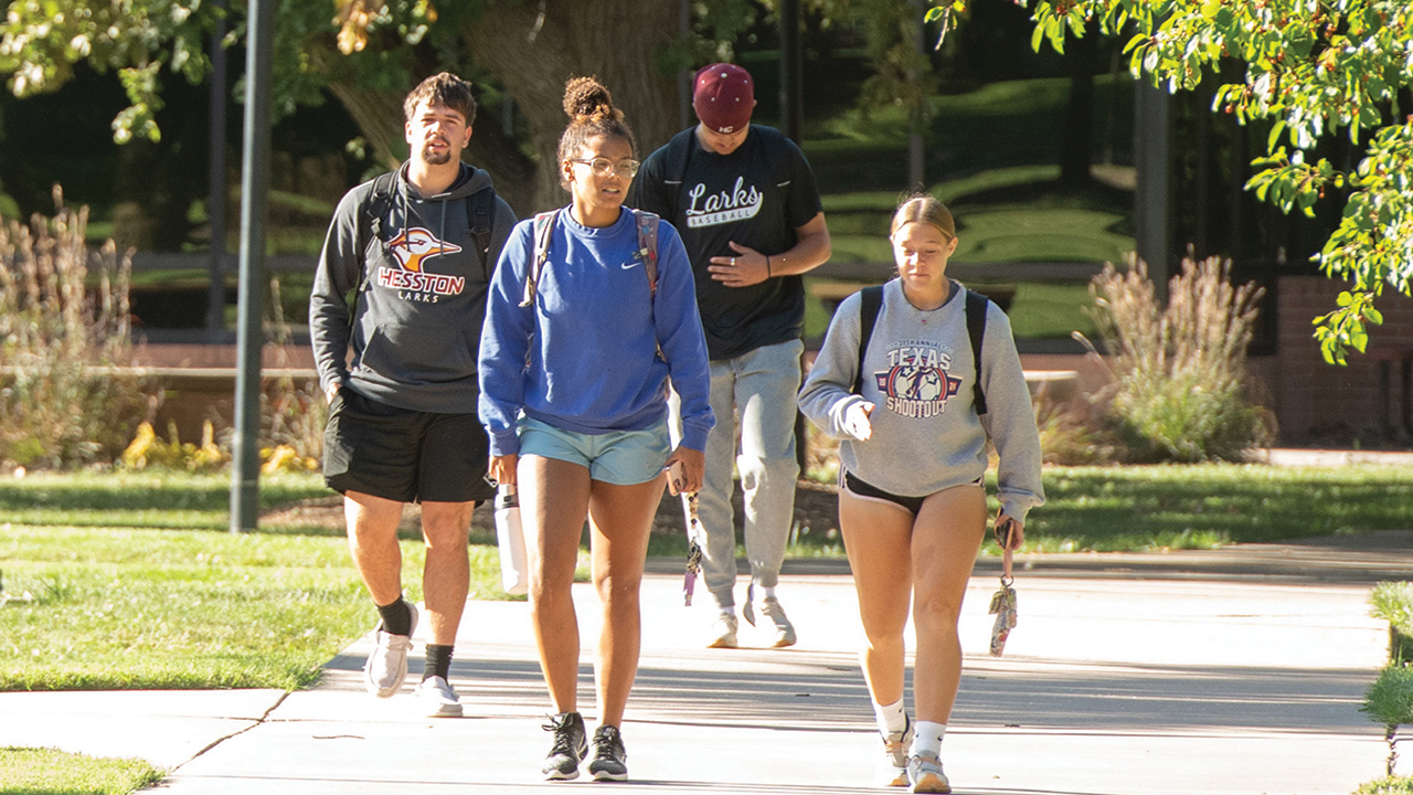 Hesston College students Caleb Cobb, Nevaeh Bowman, Jackson Sundermeyer and Kristyn Oliver walk to class Oct. 3. — Larry Bartel/Hesston College
