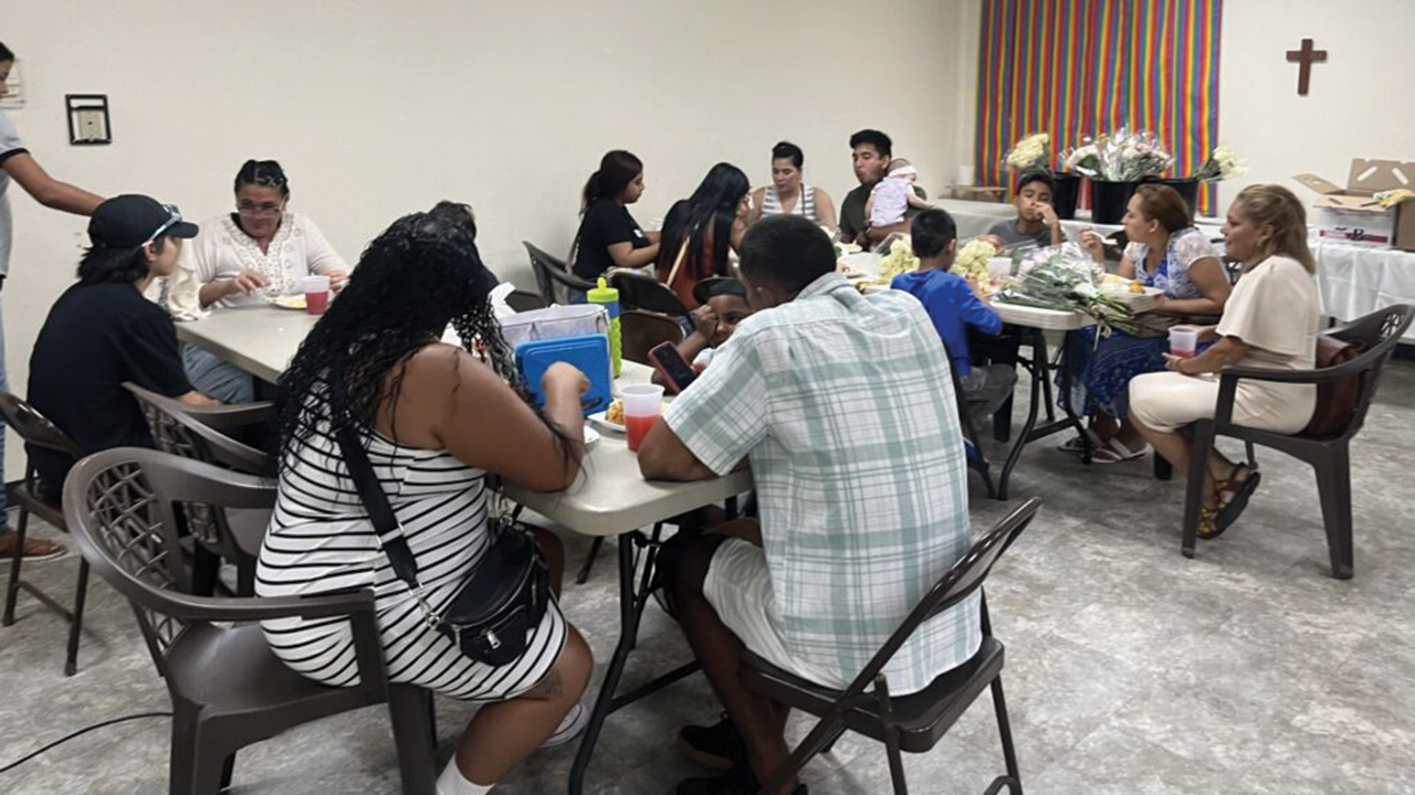 Congregants from Iglesia Cristiana Roca de Refugio in San Antonio, Texas, gather for a meal. — Dianne Garcia