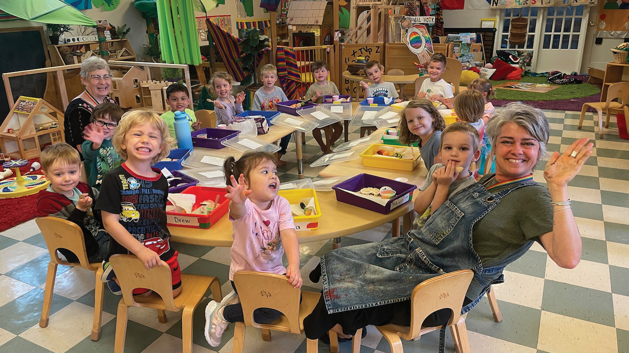 New Creation Preschool director Kristin Neufeld Epp and assistant teacher Brenda Mays with children at snack time. — Courtesy of New Creation Preschool