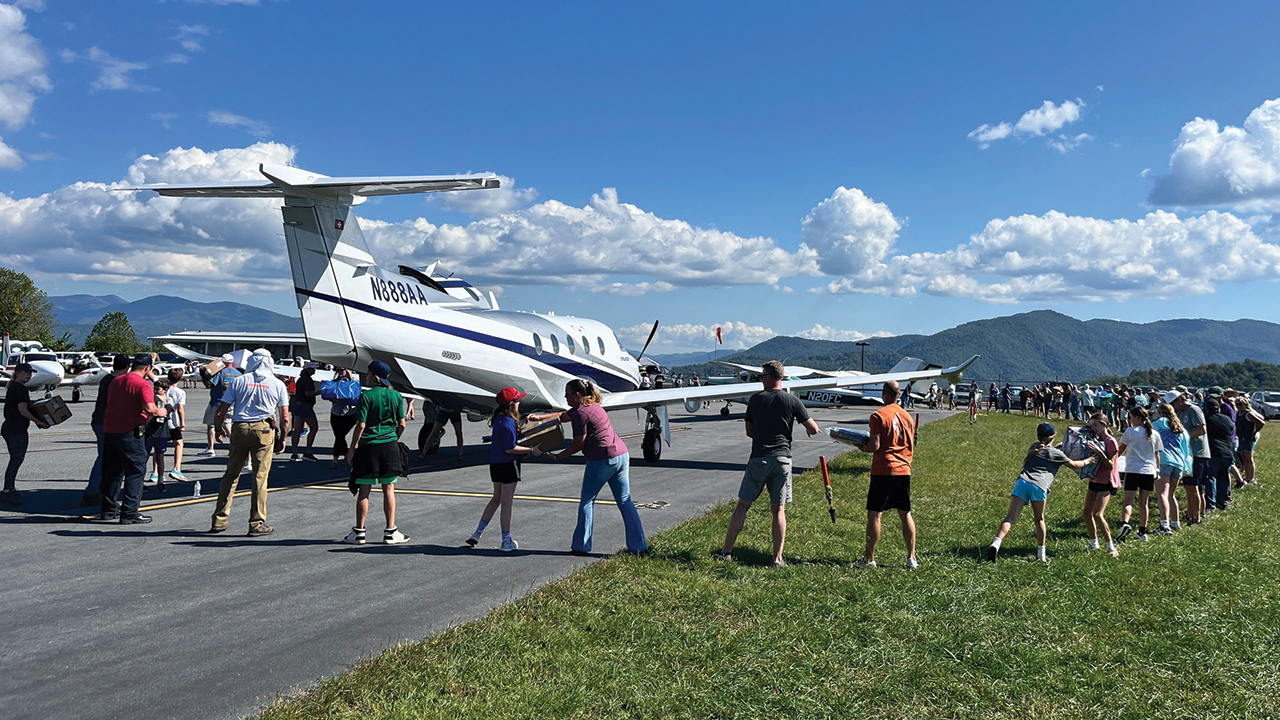 Supplies flown from Goshen, Ind., to North Carolina are unloaded Oct. 5. While there, the plane delivered another load of medical supplies to a small rural airport. — Keith Walatka