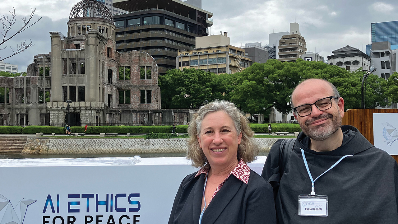 Lisa Schirch with Father Paolo Benanti of the Vatican’s “Rome Call for AI Ethics” at the Peace Park in Hiroshima, Japan. —Courtesy of Lisa Schirch