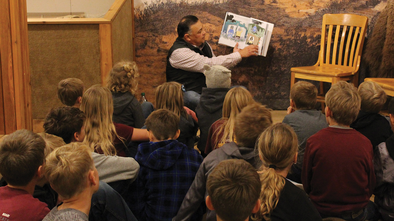David Flute, South Dakota secretary of tribal relations, reads The Medicine Quilt to Freeman Academy students Oct. 16 at the Heritage Hall Museum, which has the quilt on display. — South Dakota Office of Tribal Relations