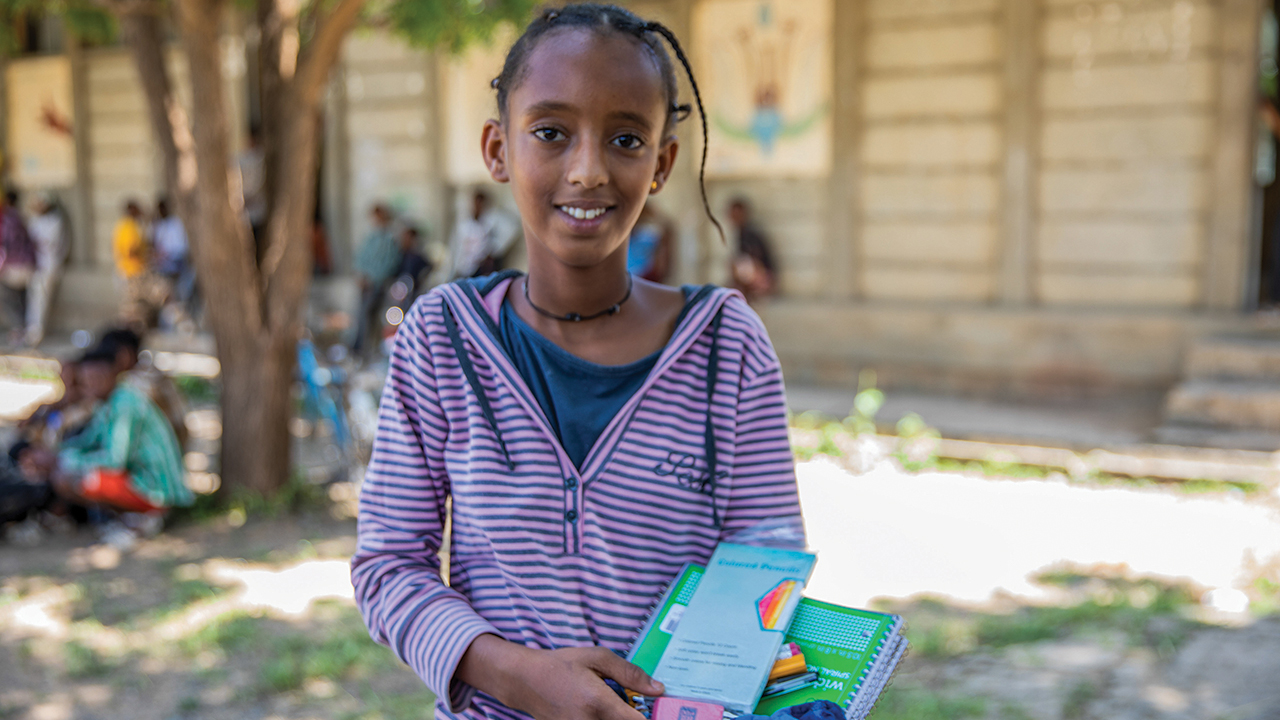 Kalkidan Fistum holds the MCC school kit supplies she will use at Enda Ferensay Elementary School. — MCC/Arete