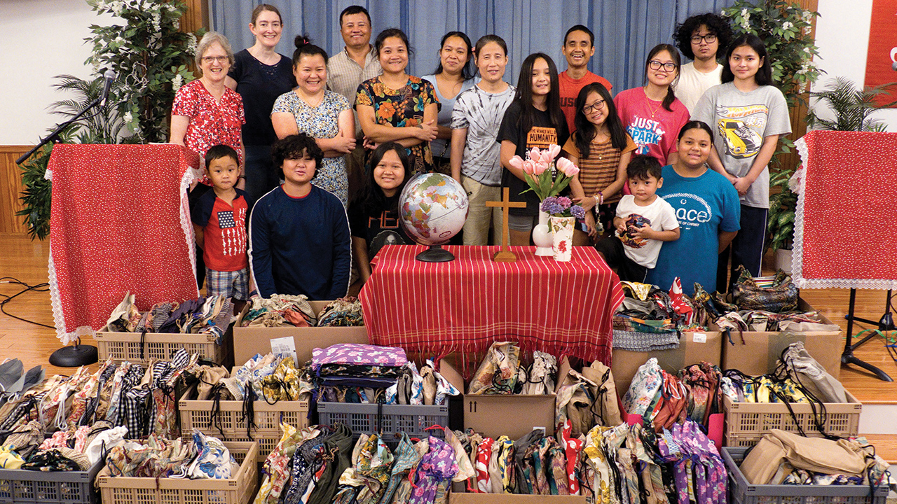 Children, teens and adults from Habecker Mennonite Church in Lancaster, Pa., assembled 256 school kits during MCC’s School Kit Challenge in August. The project was meaningful for the church, especially because some of the women remember receiving MCC school kits while living in a refugee camp in Thailand. Many adults attending Habecker are refugees, originally from Myanmar. — Courtesy of Jonathan Charles