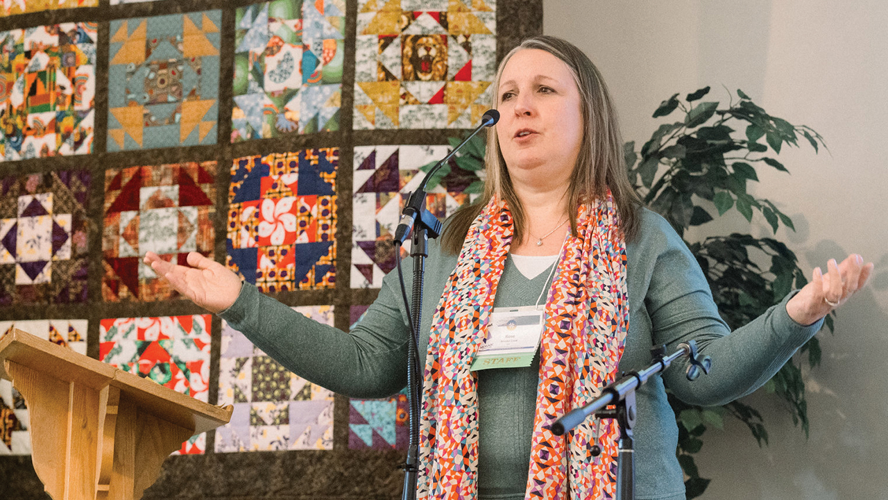 Rose Bender Cook, Mosaic Mennonite Conference leadership minister for formation, leads a prayer after the delegate vote Nov. 2 in Souderton, Pa. — Cindy Angela/Mosaic