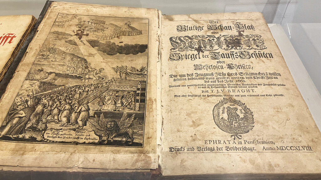TO THE NEW WORLD — A 1748 Ephrata, Pa., edition of Martyrs Mirror at the Mennonite Heritage Center in Harleysville, Pa., has a different title page than the 1685 Dutch edition. Pennsylvania Mennonites wrote to Dutch Mennonites requesting help to translate Thieleman van Braght’s Martyrs Mirror from Dutch to German — a different Old World language for a New World audience: “We consider it to be of greatest importance to become acquainted with the trustworthy witnesses who have walked in the way of truth and sacrificed their lives for it.” — Paul Schrag/AW