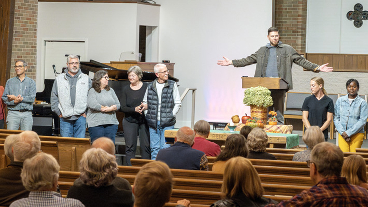 Lancaster Brethren in Christ Church Pastor Joshua Nolt blesses the Compassion House’s Welcoming Teams. — Paul Hunt/MDS