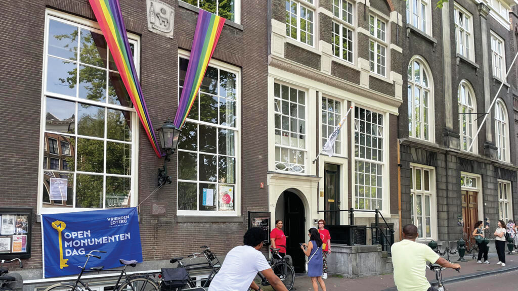 FOLLOWERS OF THE LAMB — Known today as the Singelkerk, or Singel Mennonite Church, the original name came from a nearby brewery with a lamb in the façade. The barn that served as the first meeting place was replaced in 1639 with a building at the current site. In 1801 the congregation merged with another, also named for a nearby brewery, with a sun in its sign, finally taking on the name of the Singel canal. The building is an example of a “hidden church,” not recognizable from the street as a house of worship. The lamb and sun symbols are visible at the upper left. Anabaptist churches in Menno Simons’ homeland are not named after him. Doopsgezinde (“baptism-minded”) is the official name of Mennonites in the Netherlands. — Singelkerk