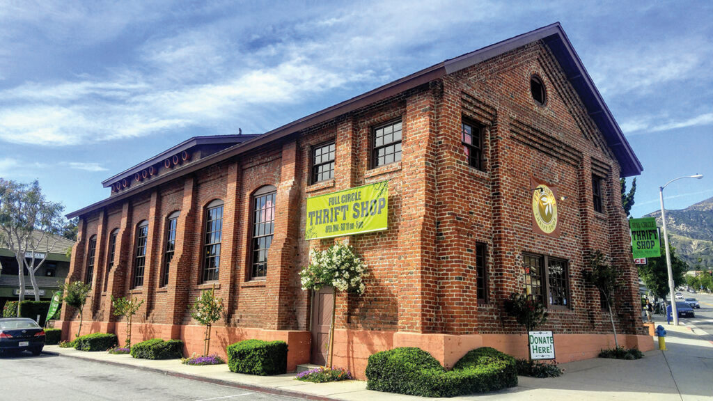 Full Circle Thrift Shop, seen here in 2022, is located in a brick building that once served an electric railway. — Full Circle Thrift Shop