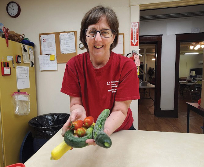 Peg Martin with garden produce. — Courtesy of Peg and Lee Martin