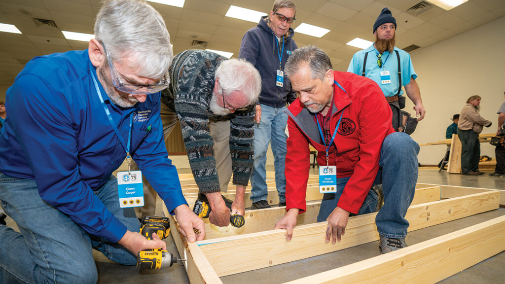 MDS celebration participants build parts of a house to be trucked to a family in Virginia. — Paul Hunt/MDS