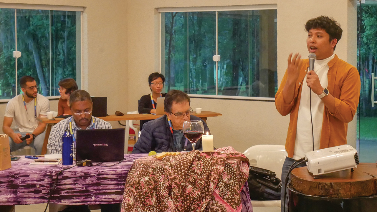 Nezer Mondez addresses the Mennonite World Conference Executive Committee in April 2024 in Curitiba, Brazil. — Mennonite World Conference