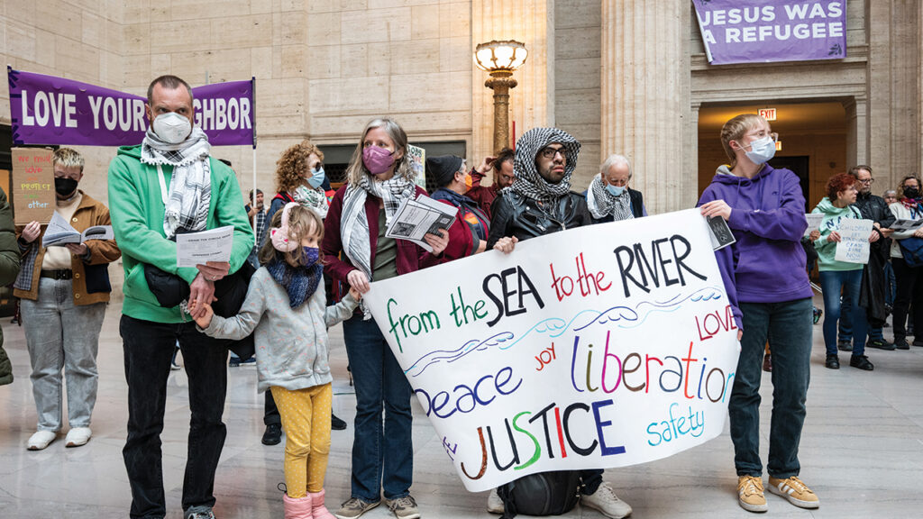 Mennonite Action Chicago takes part in a public worship service in Union Station. — Paul Goyette