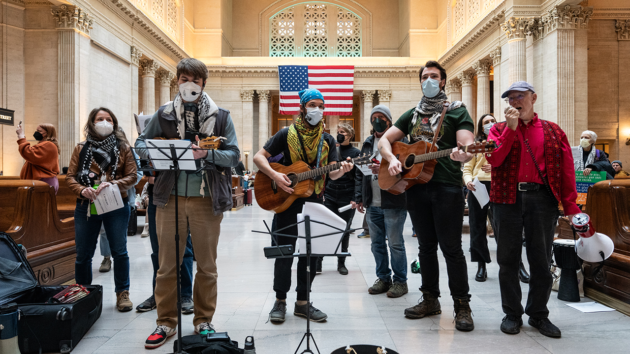 Mennonite Action Chicago joins other groups in Chicago’s Union Station to advocate for justice for Palestinians, immigrants, LGBTQ+ people and other marginalized groups on March 21. — Paul Goyette