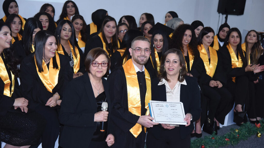 Nazareth Academic School of Nursing director Salam Hadid, center, with recent graduates. — Nazareth Project