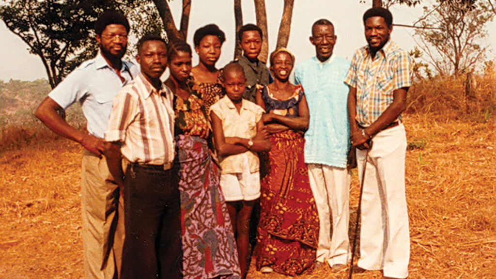 Pakisa K. Tshimika, right, with family in 1984. From left: Tshinabu Alexandre, Mandjolo Marc, Kenda Suzanne, Tshamba Laurette, Mukekwa Sammy, Mukoso Wally, mother Makeka Rebecca, father Mutondo Isaac Tshimika and Pakisa. — Courtesy of Pakisa K. Tshimika