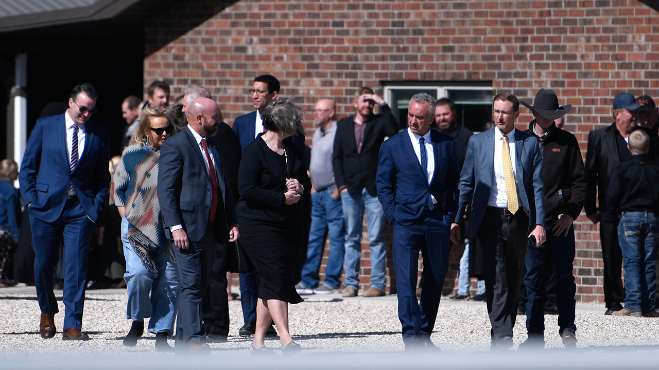 Health and Human Services Secretary Robert F. Kennedy Jr., center right, arrives at Reinlander Mennonite Church after a second measles death on April 6 in Seminole, Texas. — Annie Rice/AP