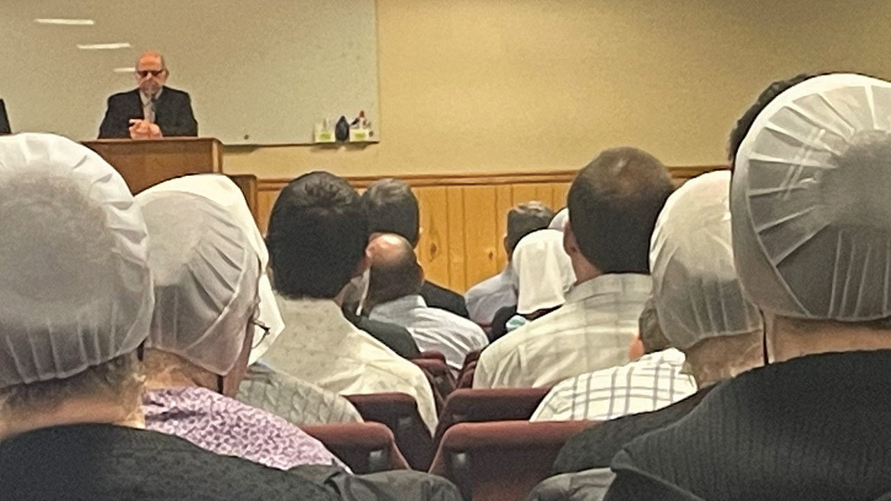 Lester Burkholder speaks about early Protestant reformers, including Desiderius Erasmus, Martin Luther and Ulrich Zwingli, at an Anabaptist history conference in Ephrata, Pa. —Joel Nofziger