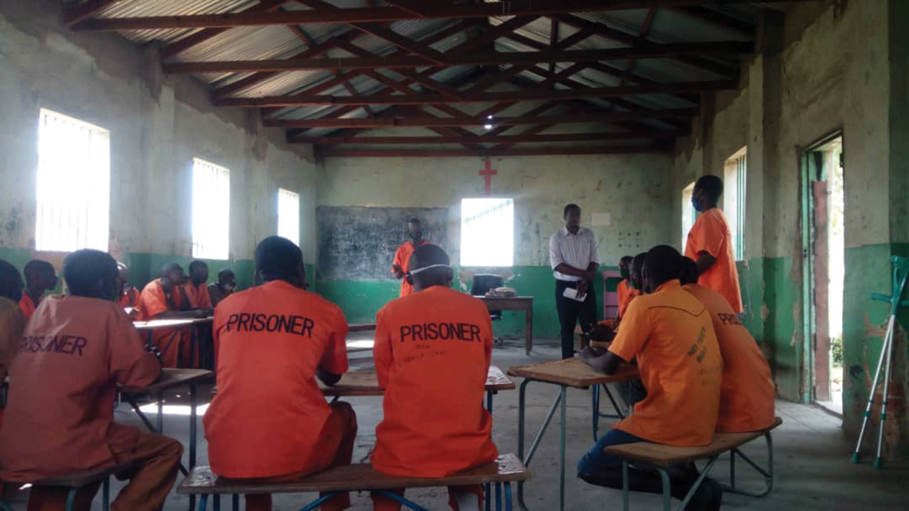 Jason Sipulwa, an MCC worker from Kenya, facilitates a peace club session in a correctional facility in Zambia in 2020. Sipulwa works with Zambia Correctional Service, which is facing a significant loss of U.S. foreign aid. — Ruth Sami/MCC