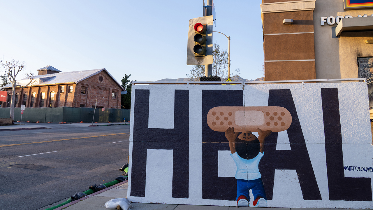 Full Circle Thrift, left, which supports ministries of Pacific Southwest Mennonite Conference, escaped significant damage, unlike surrounding buildings. — Paul Hunt/MDS