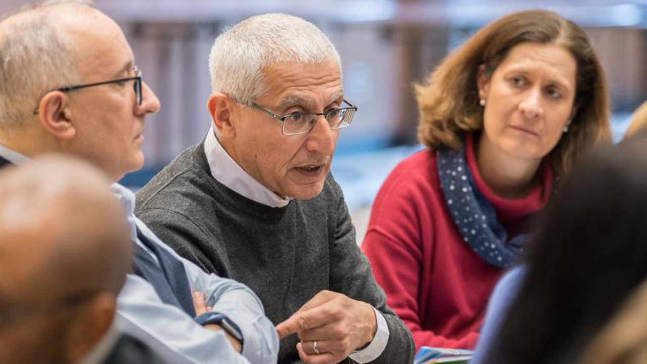 Yusef Daher converses with colleagues at the World Council of Churches. — Albin Hillert/WCC